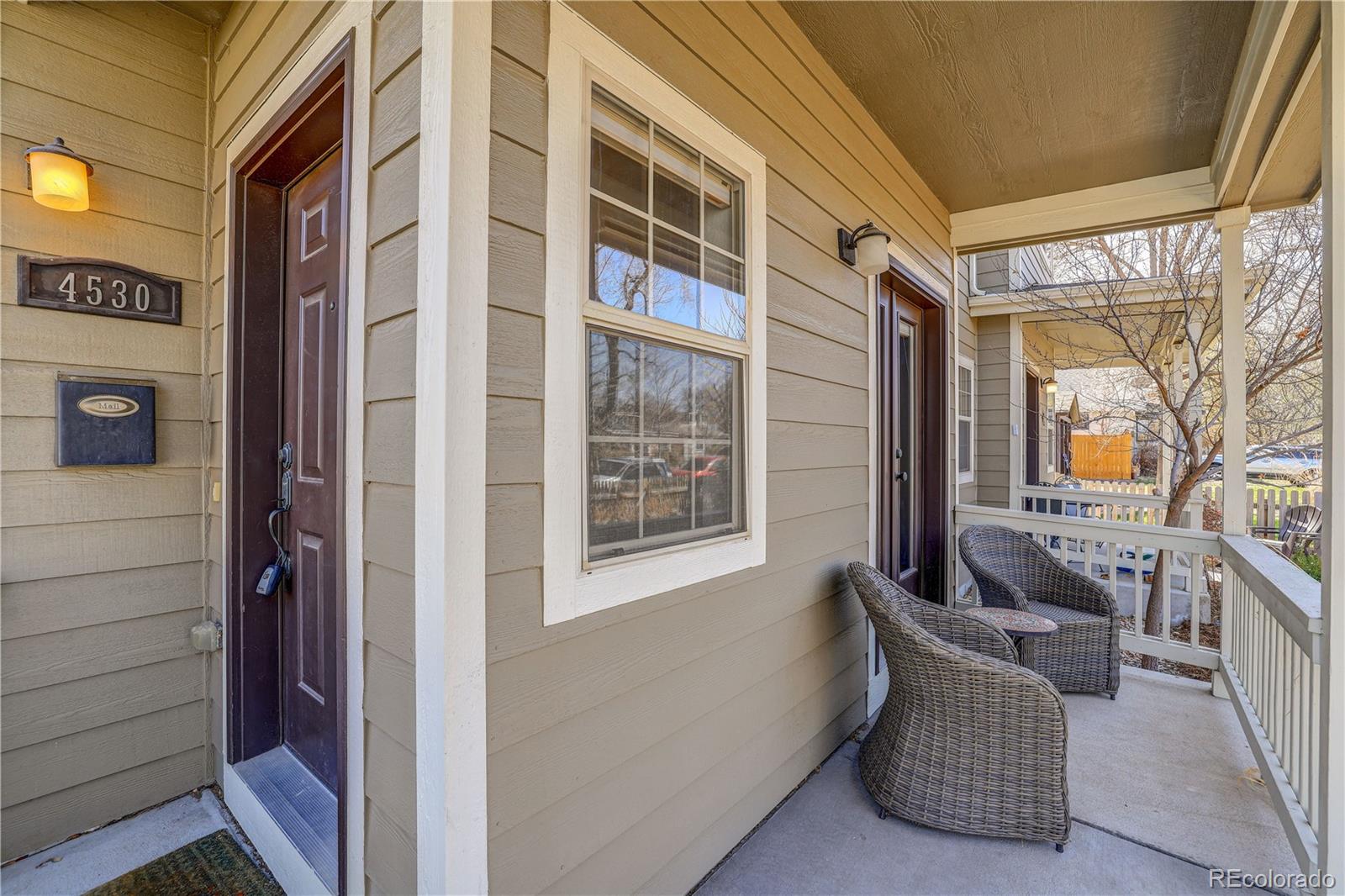 4530 Quitman Street Denver, CO 80212 - Photo 5 of 40 a balcony with furniture and a window