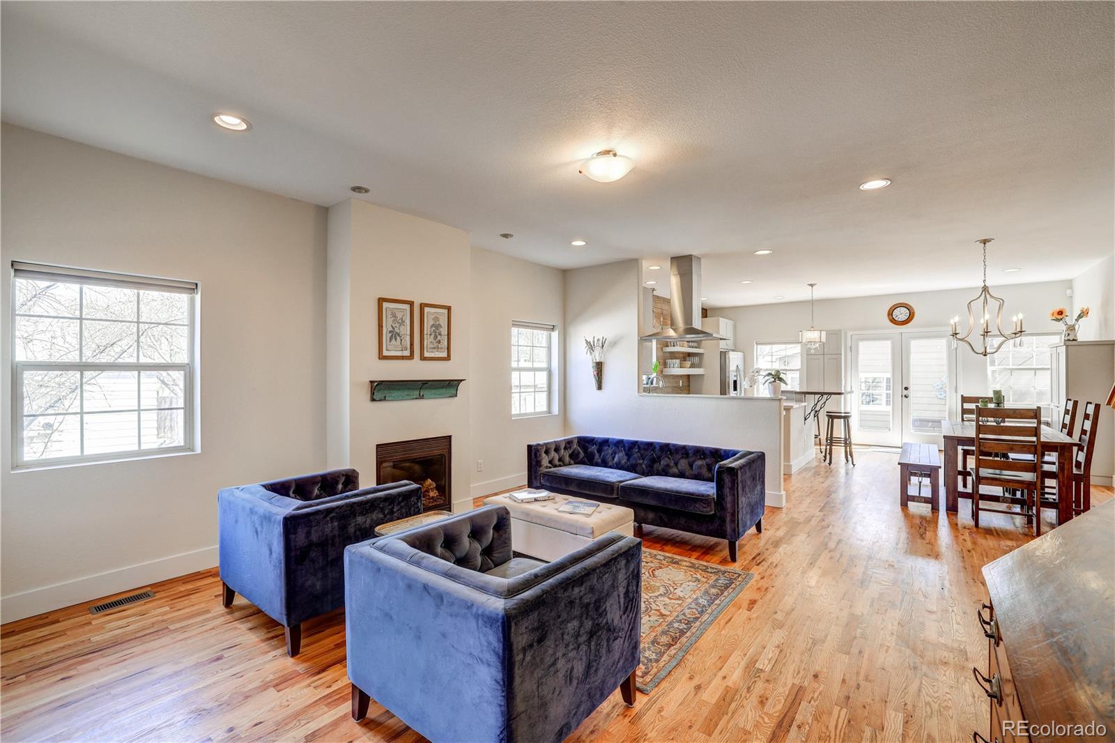 4530 Quitman Street Denver, CO 80212 - Photo 6 of 40 a living room with furniture and wooden floor