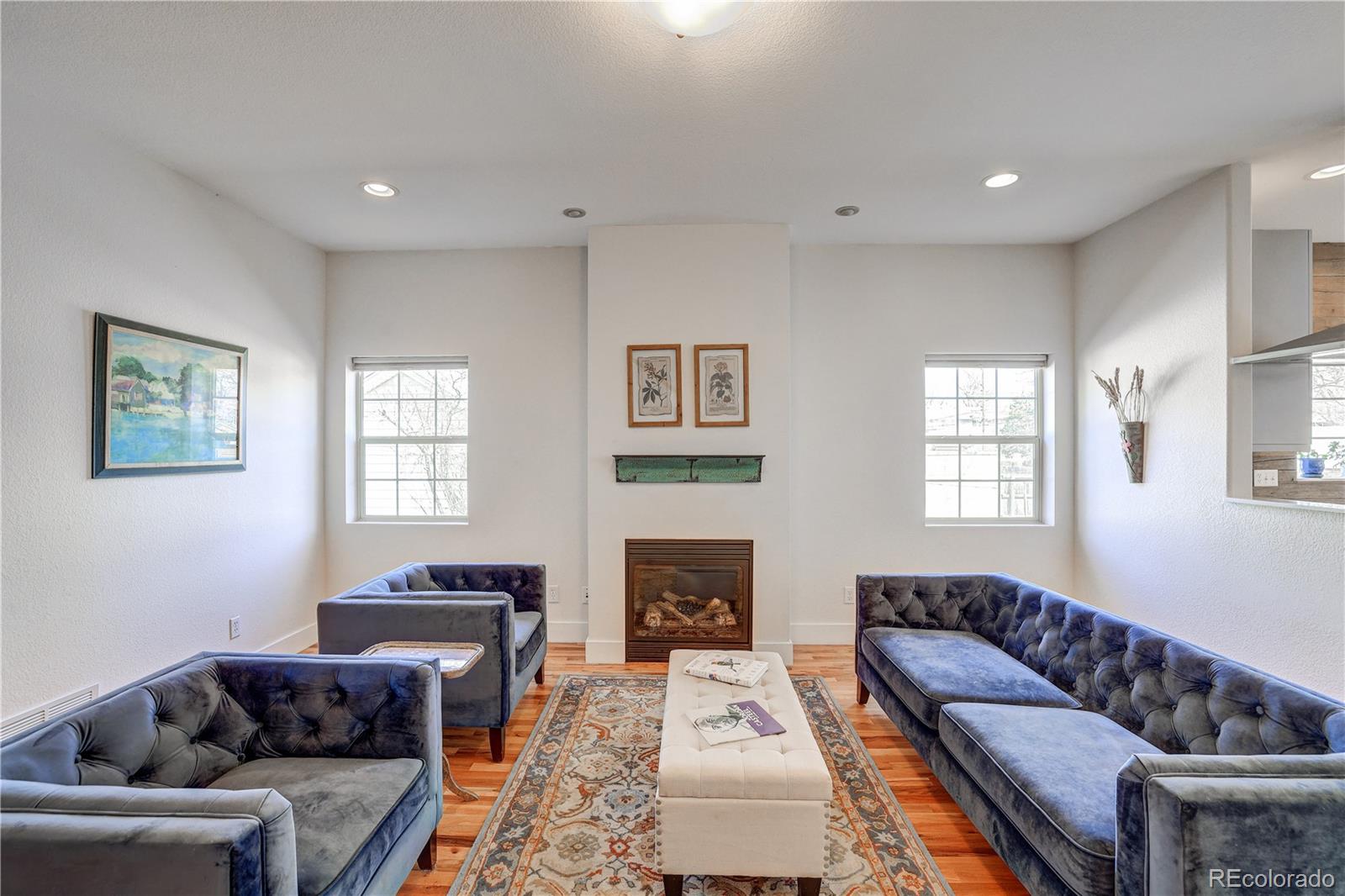 4530 Quitman Street Denver, CO 80212 - Photo 8 of 40 a living room with furniture a couch and a fireplace