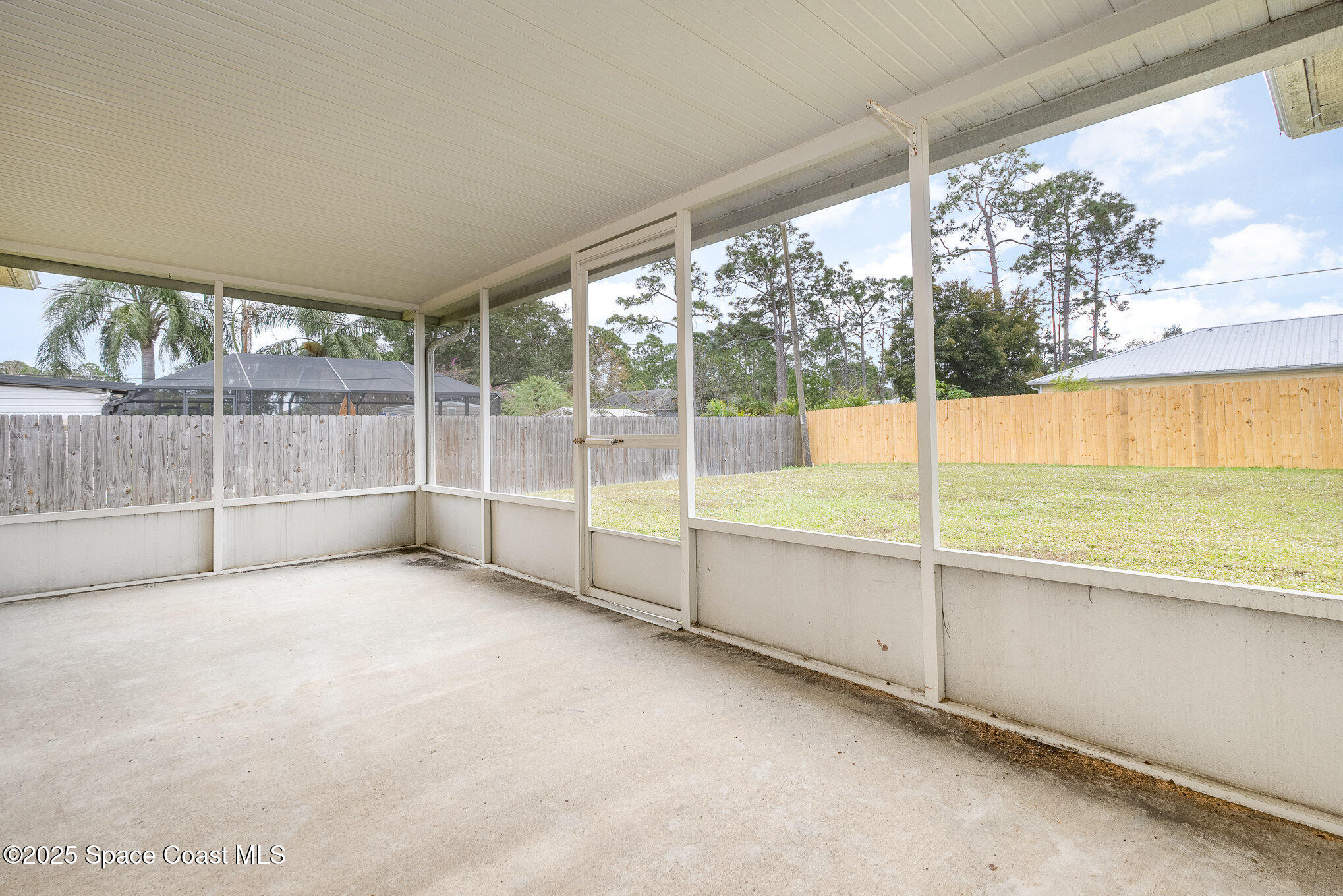 1328 Whitehurst Road Southwest Palm Bay, FL 32908 - Photo 6 of 22 large screened porch + fenced yard