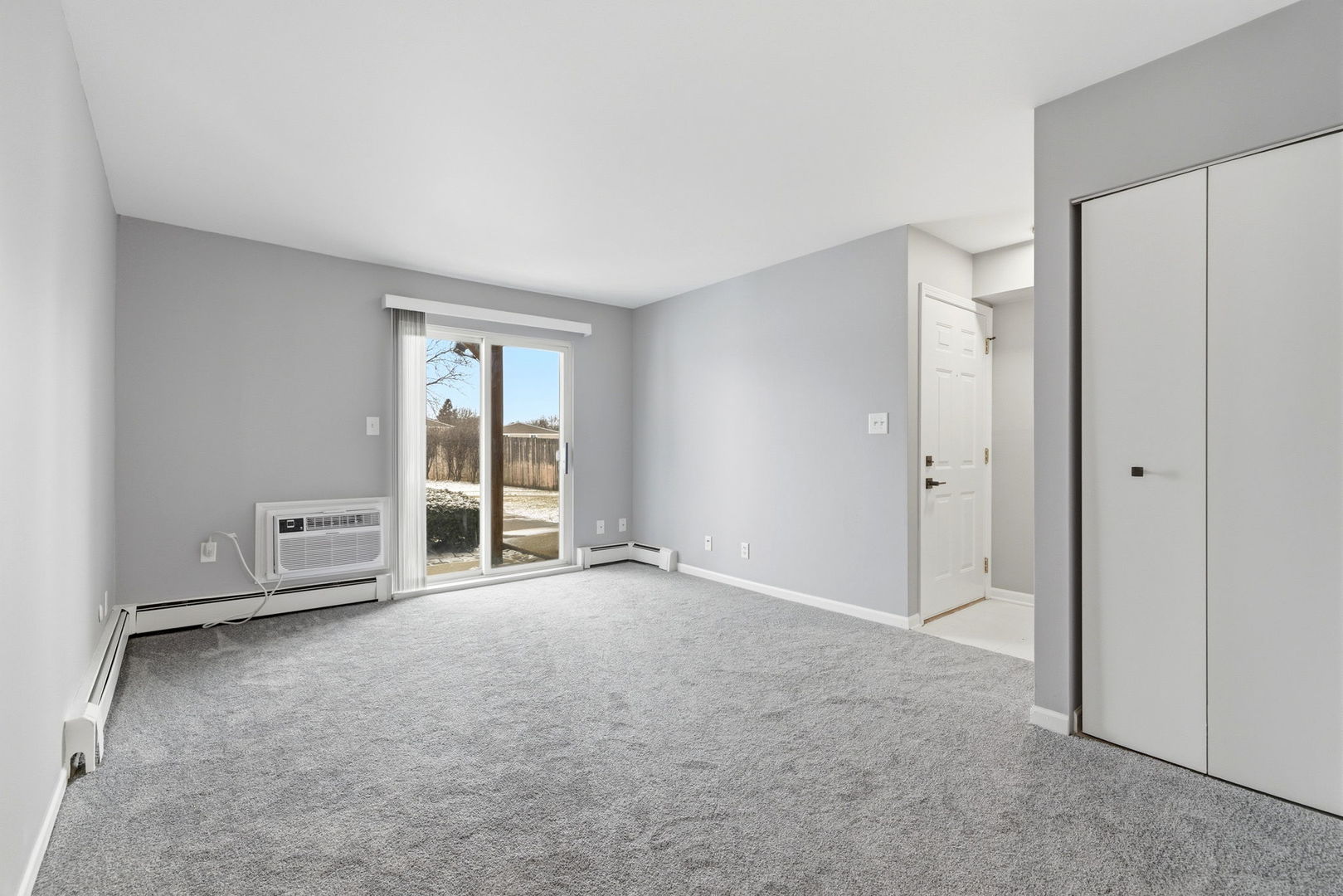 2800 Light Road, Unit 102 Oswego, IL 60543 - Photo 4 of 12 a view of an empty room with a window