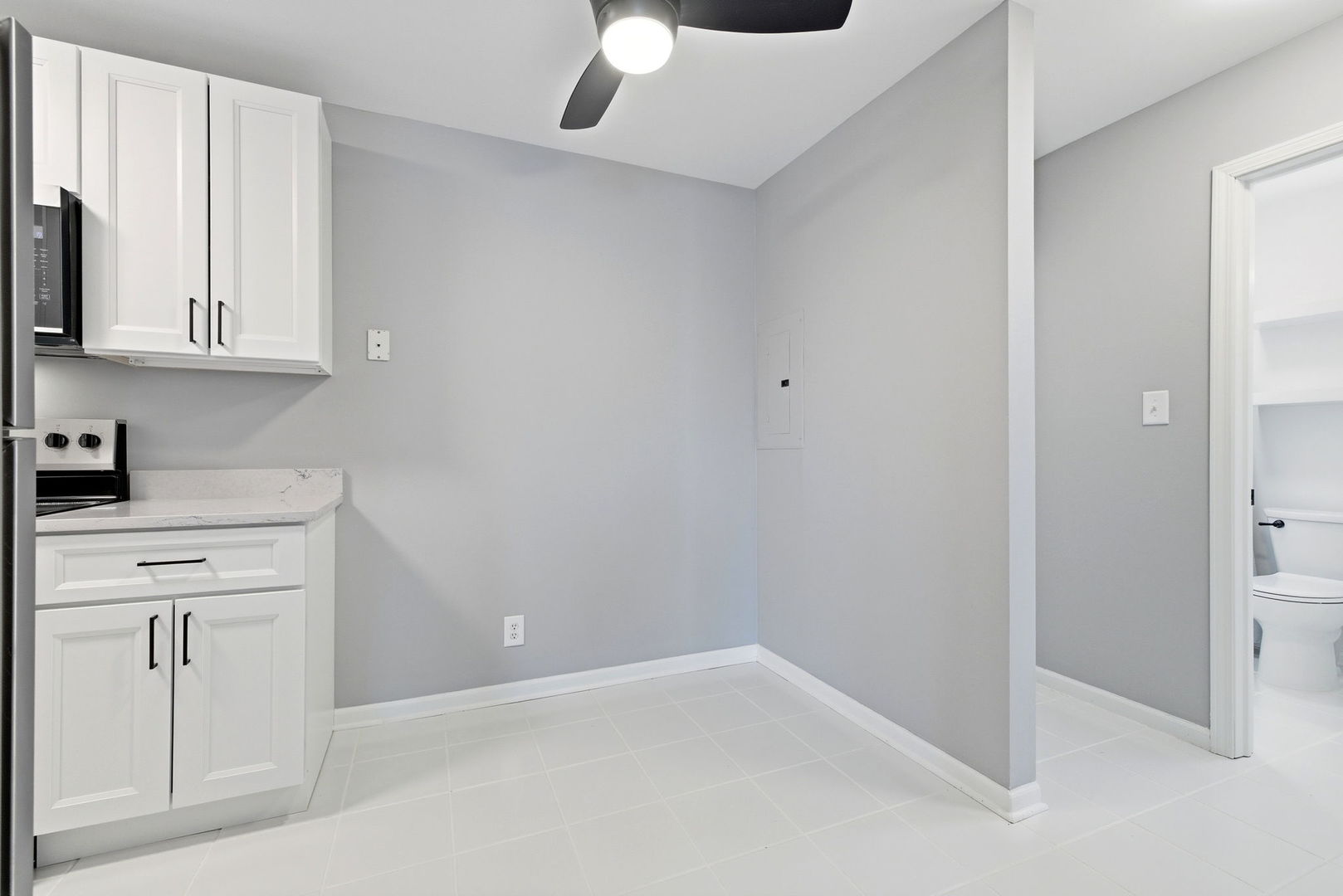 2800 Light Road, Unit 102 Oswego, IL 60543 - Photo 7 of 12 a kitchen with white cabinets and sink