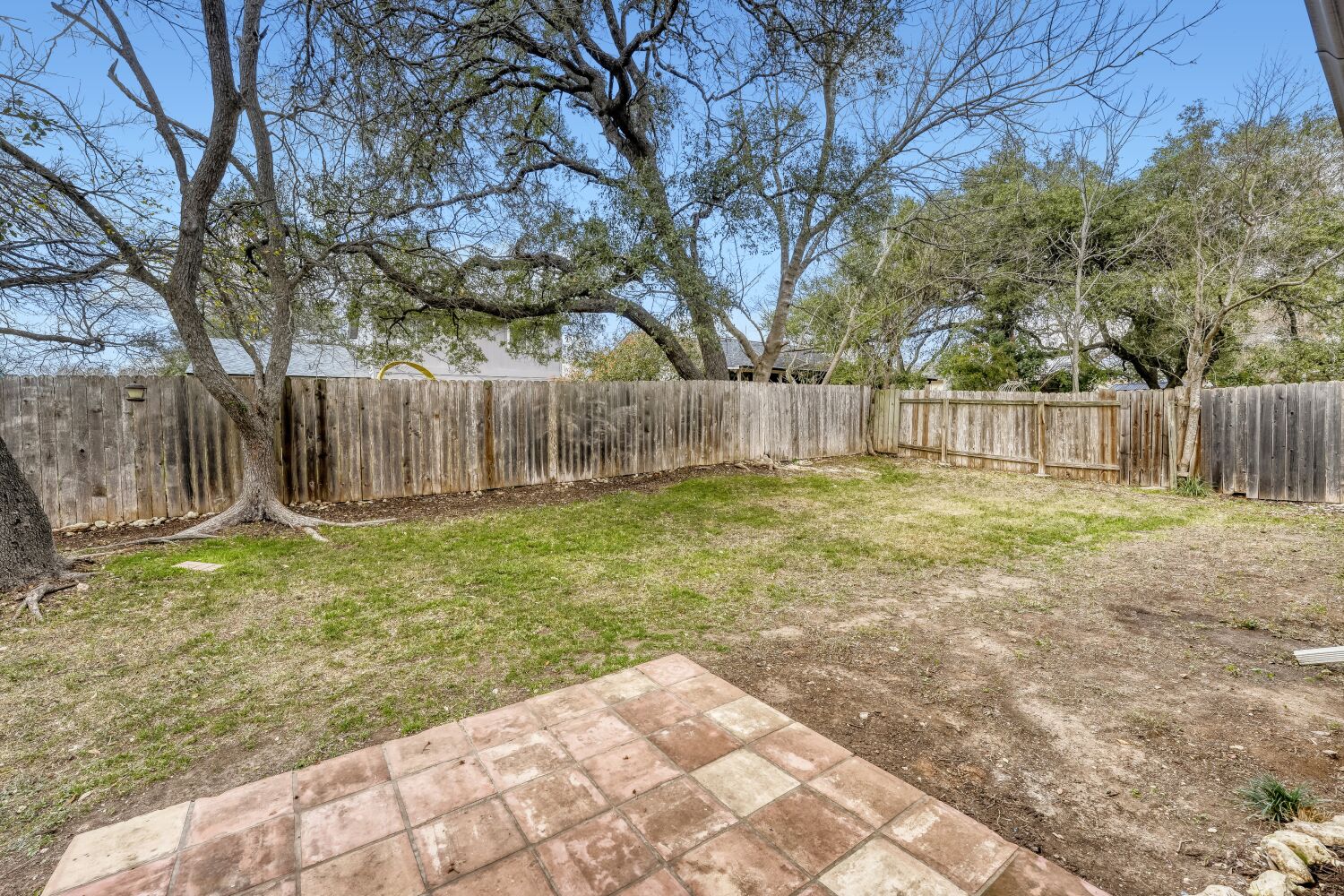 9100 Wagtail Drive Austin, TX 78748 - Photo 19 of 23 Fenced backyard featuring a Saltillo tile patio area