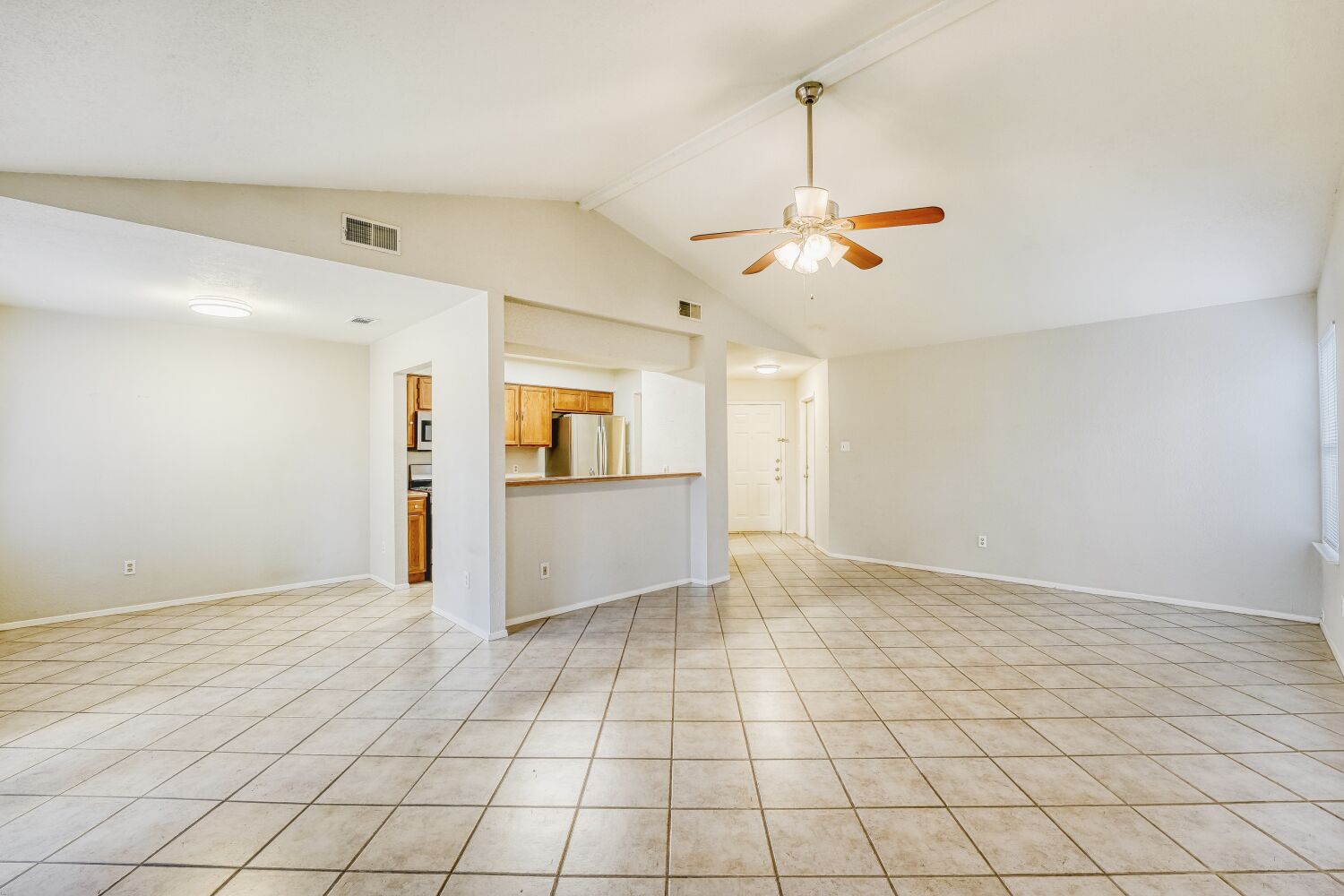 9100 Wagtail Drive Austin, TX 78748 - Photo 6 of 23 Looking back on the on the living room, dining area and open bar to kitchen.