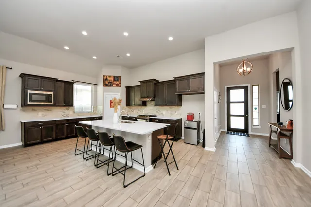 a open kitchen with a table and chairs in it