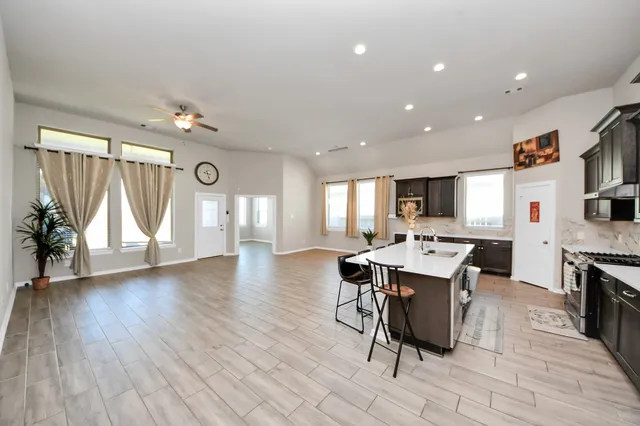 a view of a dining room with furniture and wooden floor