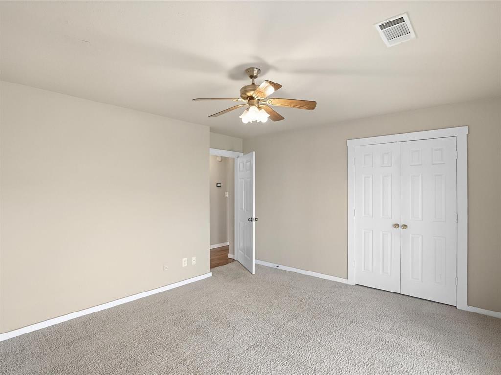 6568 Michael Road Sanger, TX 76266 - Photo 20 of 33 a view of a room with a ceiling fan and a chandelier fan