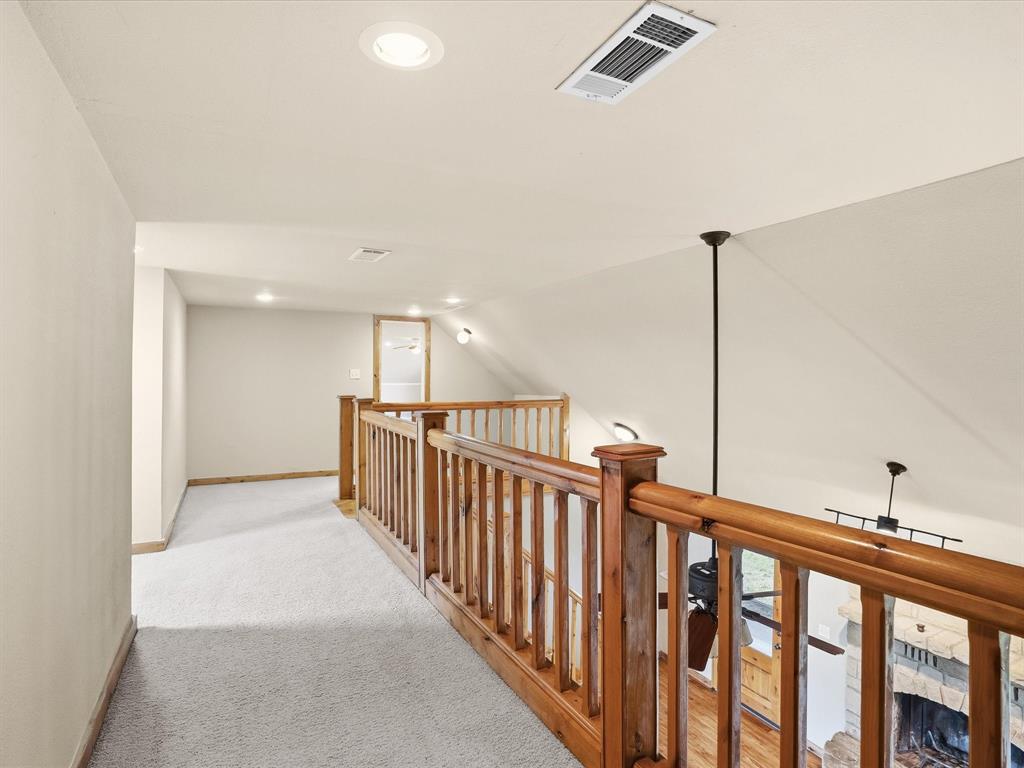 6568 Michael Road Sanger, TX 76266 - Photo 23 of 33 a view of a hallway with windows