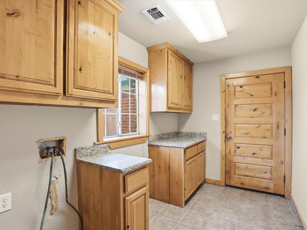 6568 Michael Road Sanger, TX 76266 - Photo 26 of 33 a kitchen with a stove and a sink
