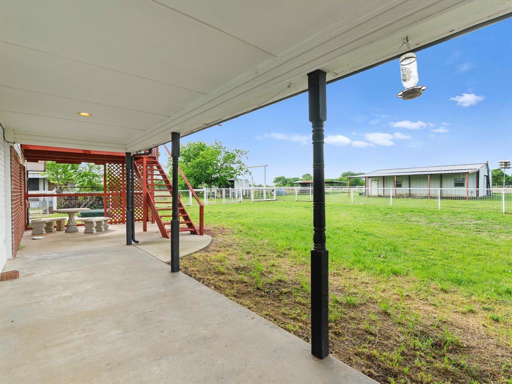 6568 Michael Road Sanger, TX 76266 - Photo 27 of 33 a view of a room with yard and flat screen tv