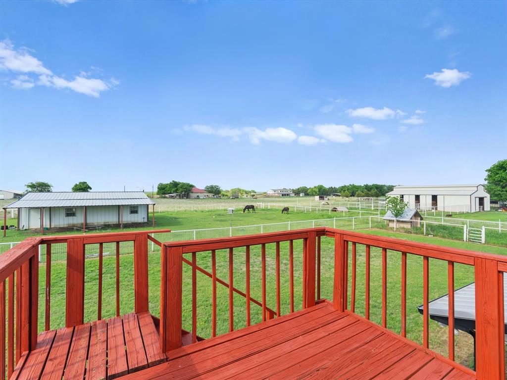 6568 Michael Road Sanger, TX 76266 - Photo 28 of 33 a view of a balcony with wooden floor and fence