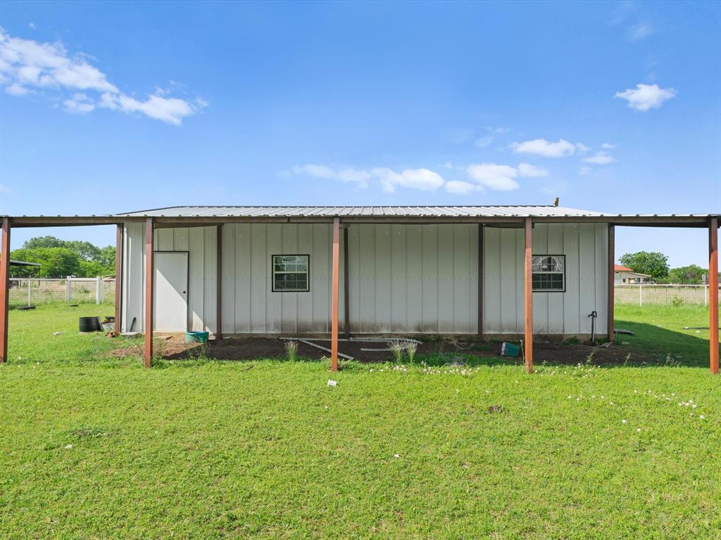 6568 Michael Road Sanger, TX 76266 - Photo 32 of 33 a backyard of a house with lots of green space