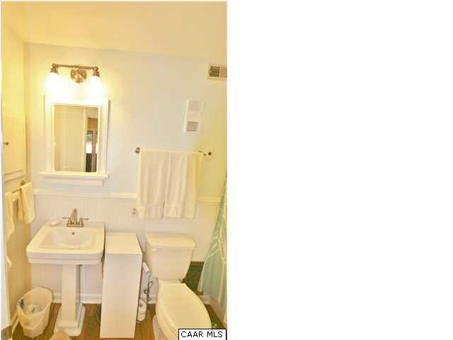456 Three Ridges Roseland, VA 22967 - Photo 6 of 8 a bathroom with a sink and mirror with toilet