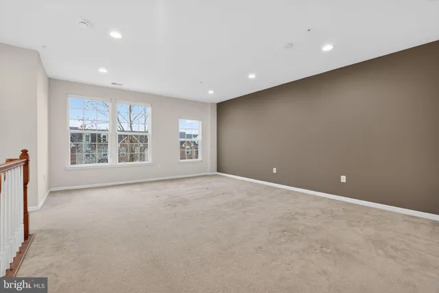 a view of an empty room with windows