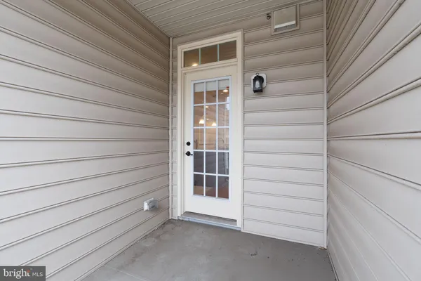 a view of front door and a window