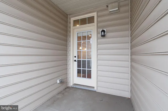 a view of front door and a window