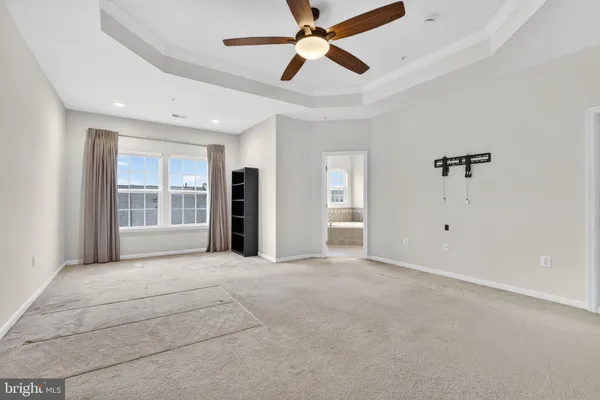 a big room with closet and windows