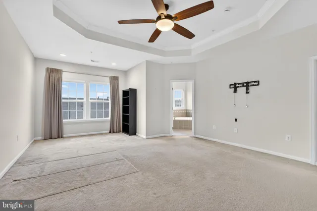 a big room with closet and windows