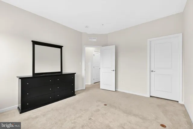 a bathroom with a tub a sink and a mirror