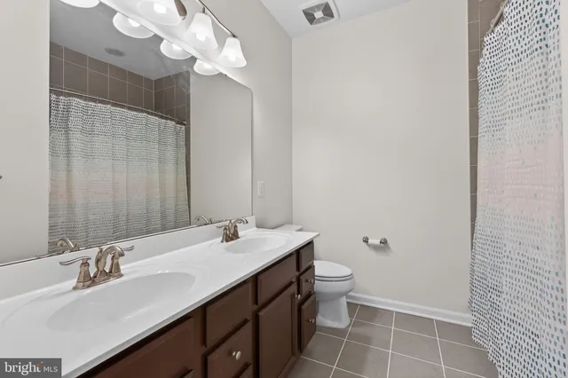a bathroom with a bathtub and a window