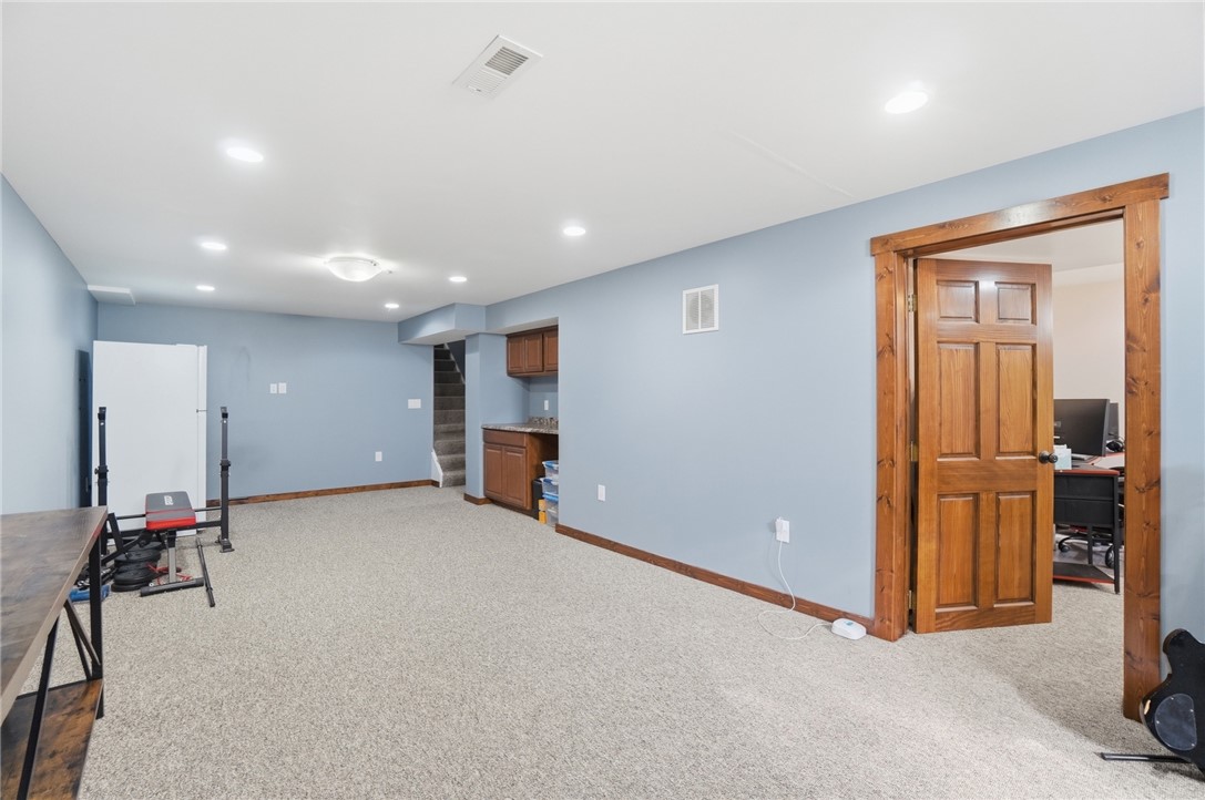 1325 Chelsea Road Troy, OH 45373 - Photo 31 of 42 This versatile basement features recessed lighting and ample space for various activities.