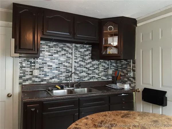 a kitchen with a stove and a sink