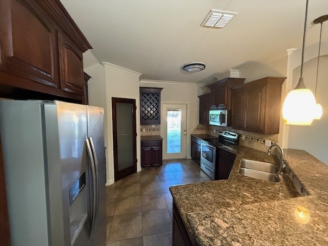 6933 Spring Wind Corpus Christi, TX 78413 - Photo 5 of 11 a kitchen with stainless steel appliances granite countertop a refrigerator a stove and a sink