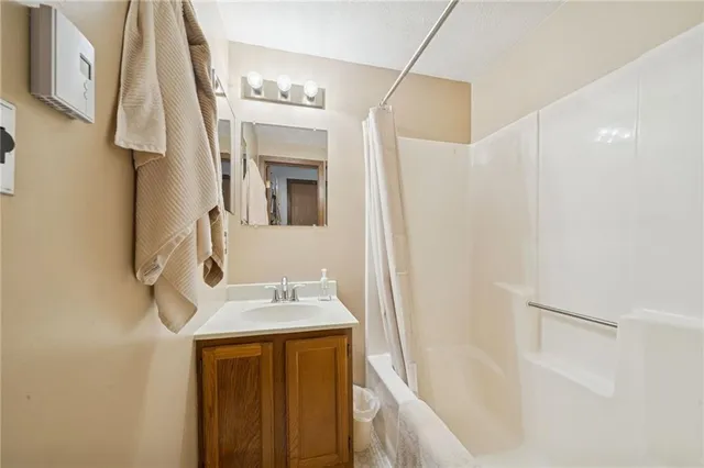 a bathroom with a sink a mirror and a bathtub