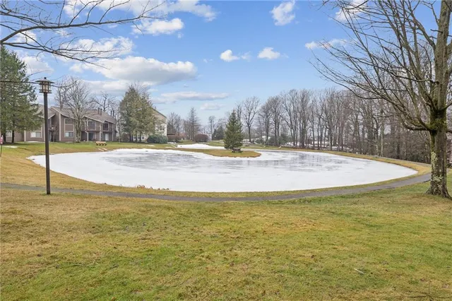 a view of an outdoor space and basketball court