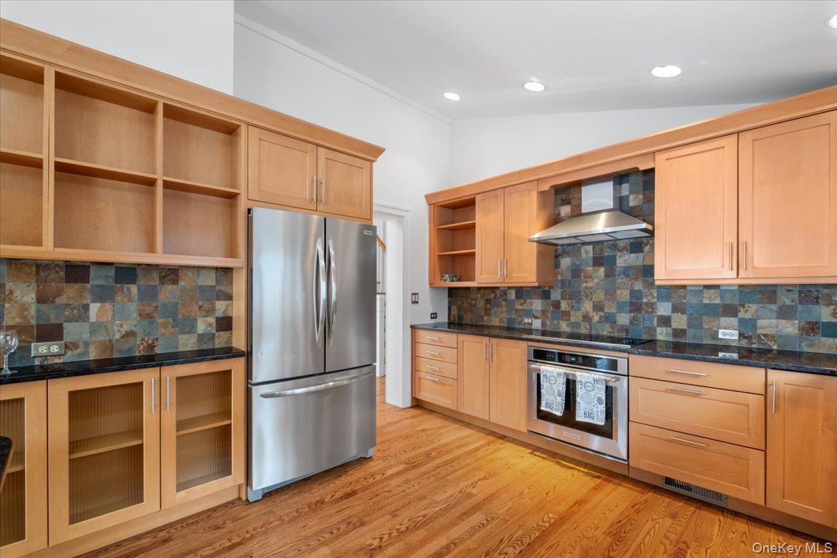 9 Tanglewood Road Scarsdale, NY 10583 - Photo 19 of 33 a kitchen with stainless steel appliances granite countertop a refrigerator sink and cabinets
