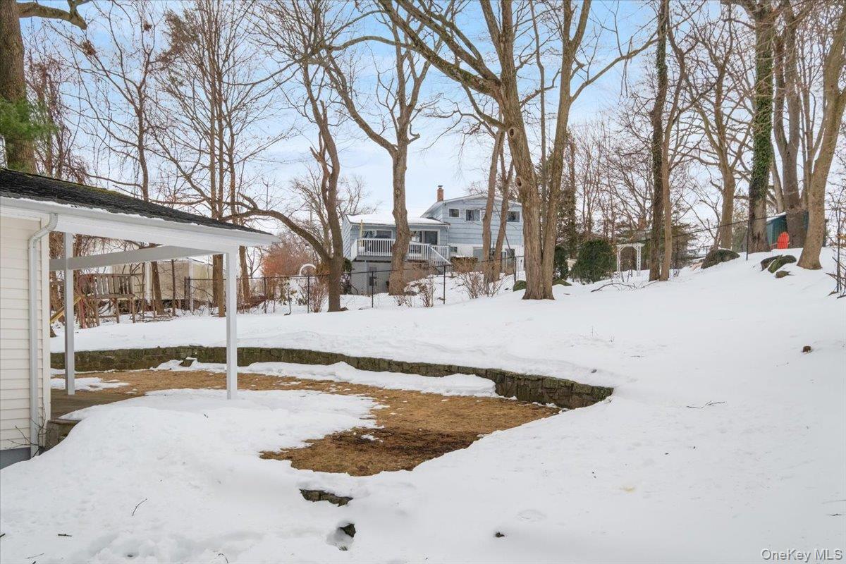 9 Tanglewood Road Scarsdale, NY 10583 - Photo 27 of 33 a view of a house with snow on the road