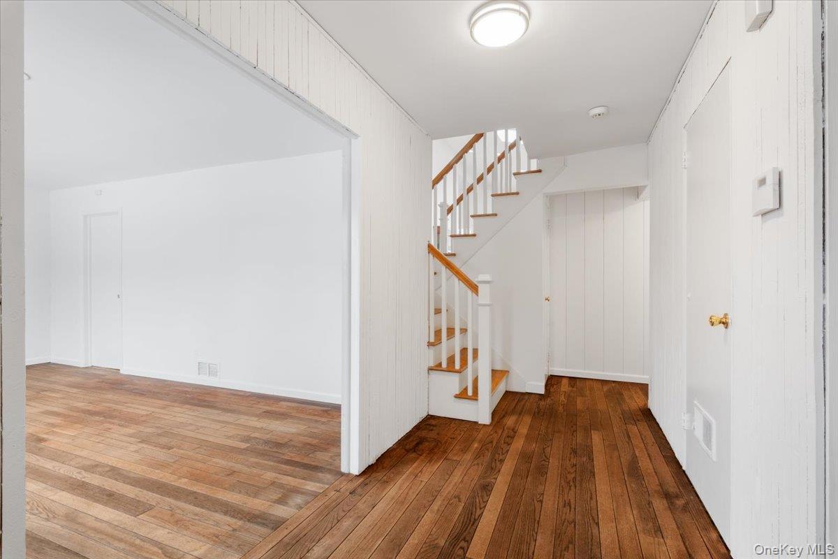 9 Tanglewood Road Scarsdale, NY 10583 - Photo 4 of 33 a view of a hallway with wooden floor