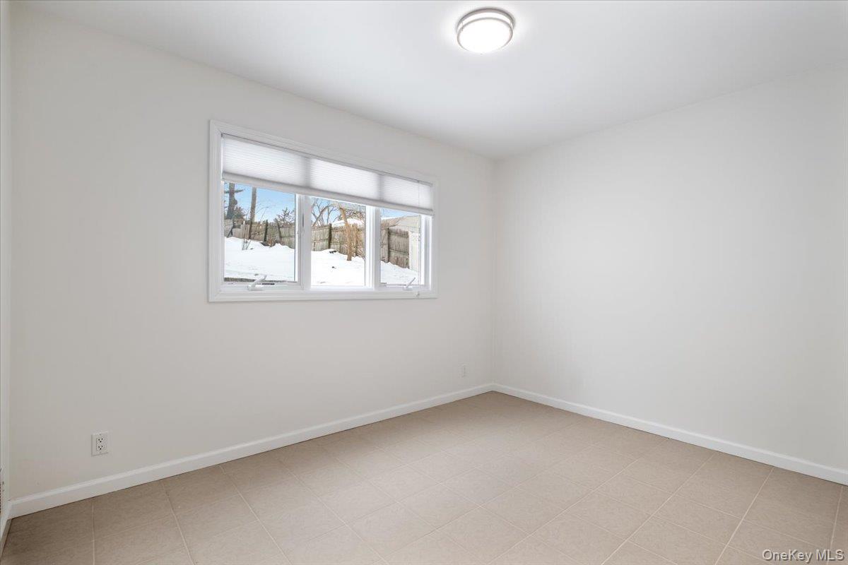 9 Tanglewood Road Scarsdale, NY 10583 - Photo 9 of 33 an empty room with a window