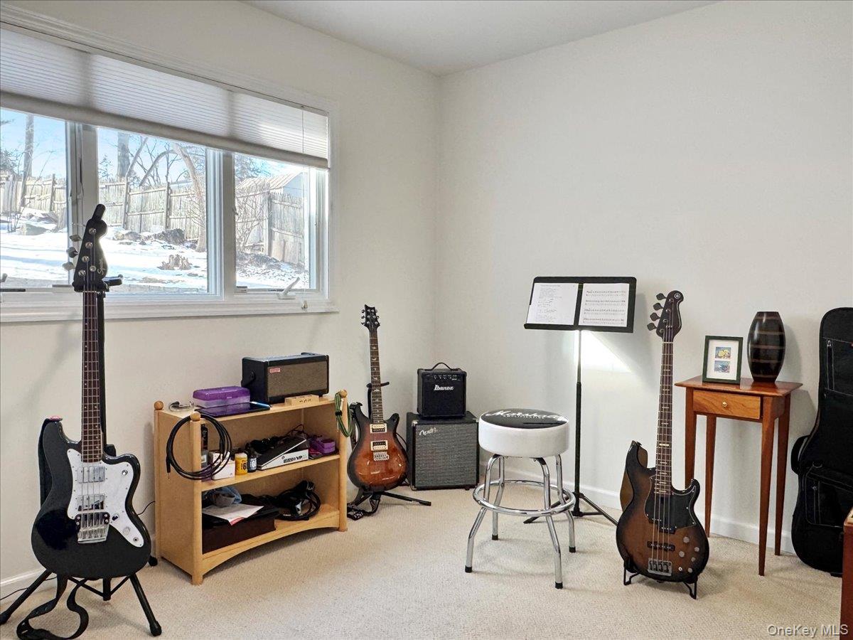 9 Tanglewood Road Scarsdale, NY 10583 - Photo 10 of 33 a room with furniture a flat screen tv and a window