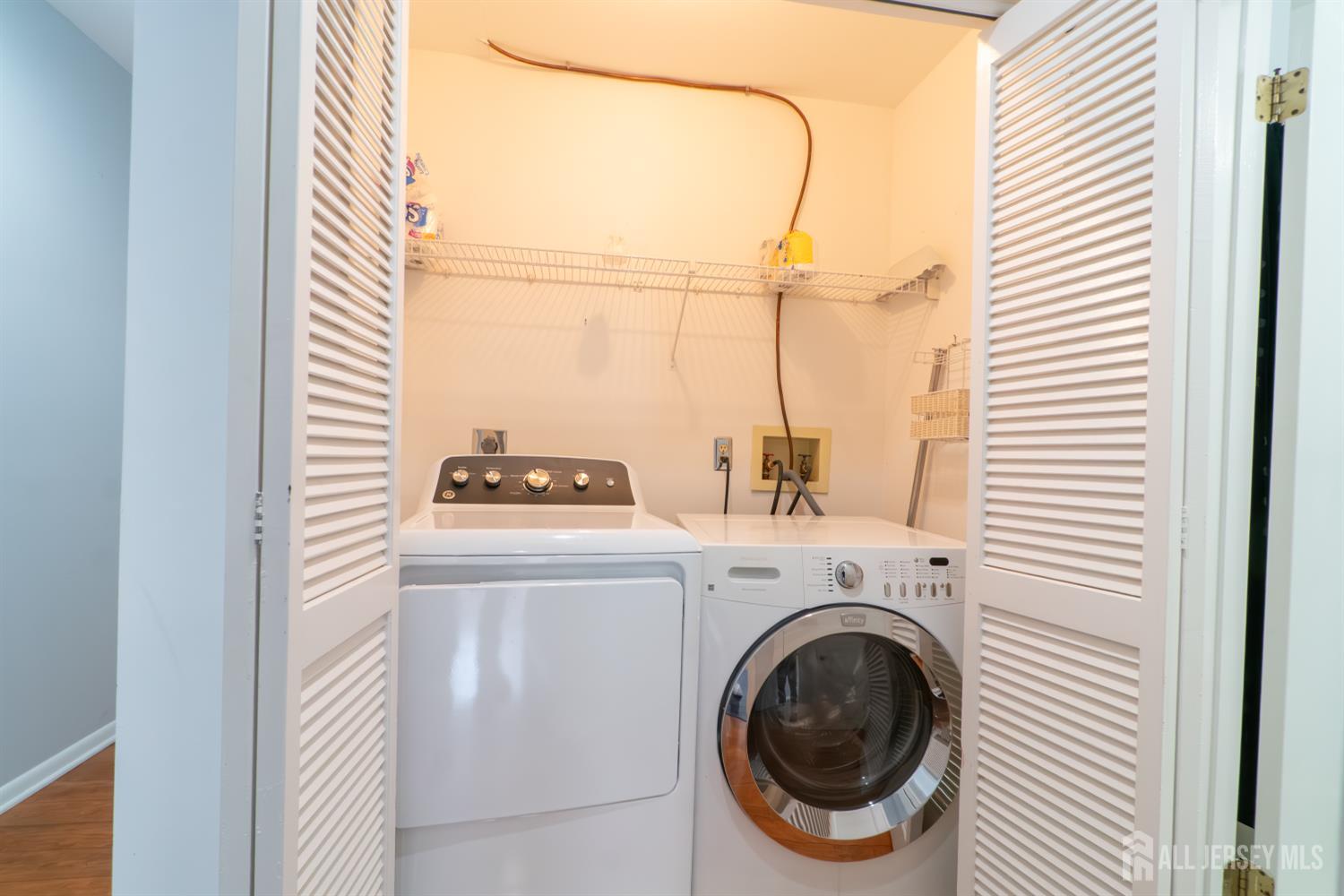166 Hidden Hollow Court Edison, NJ 08820 - Photo 18 of 36 a utility room with dryer and washer