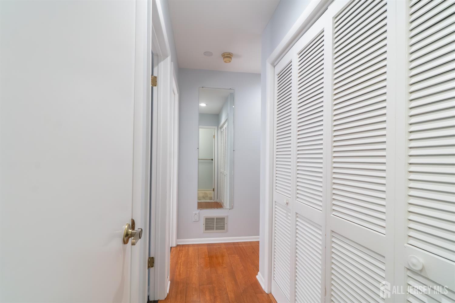 166 Hidden Hollow Court Edison, NJ 08820 - Photo 24 of 36 a view of a hallway with a window