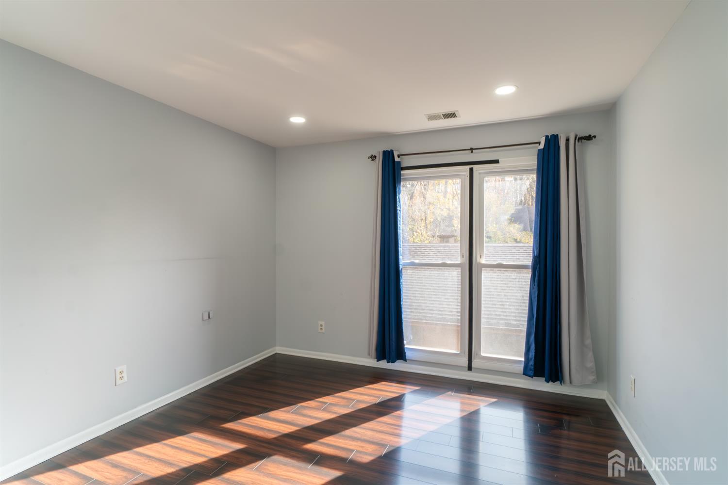 166 Hidden Hollow Court Edison, NJ 08820 - Photo 25 of 36 a view of an empty room and window