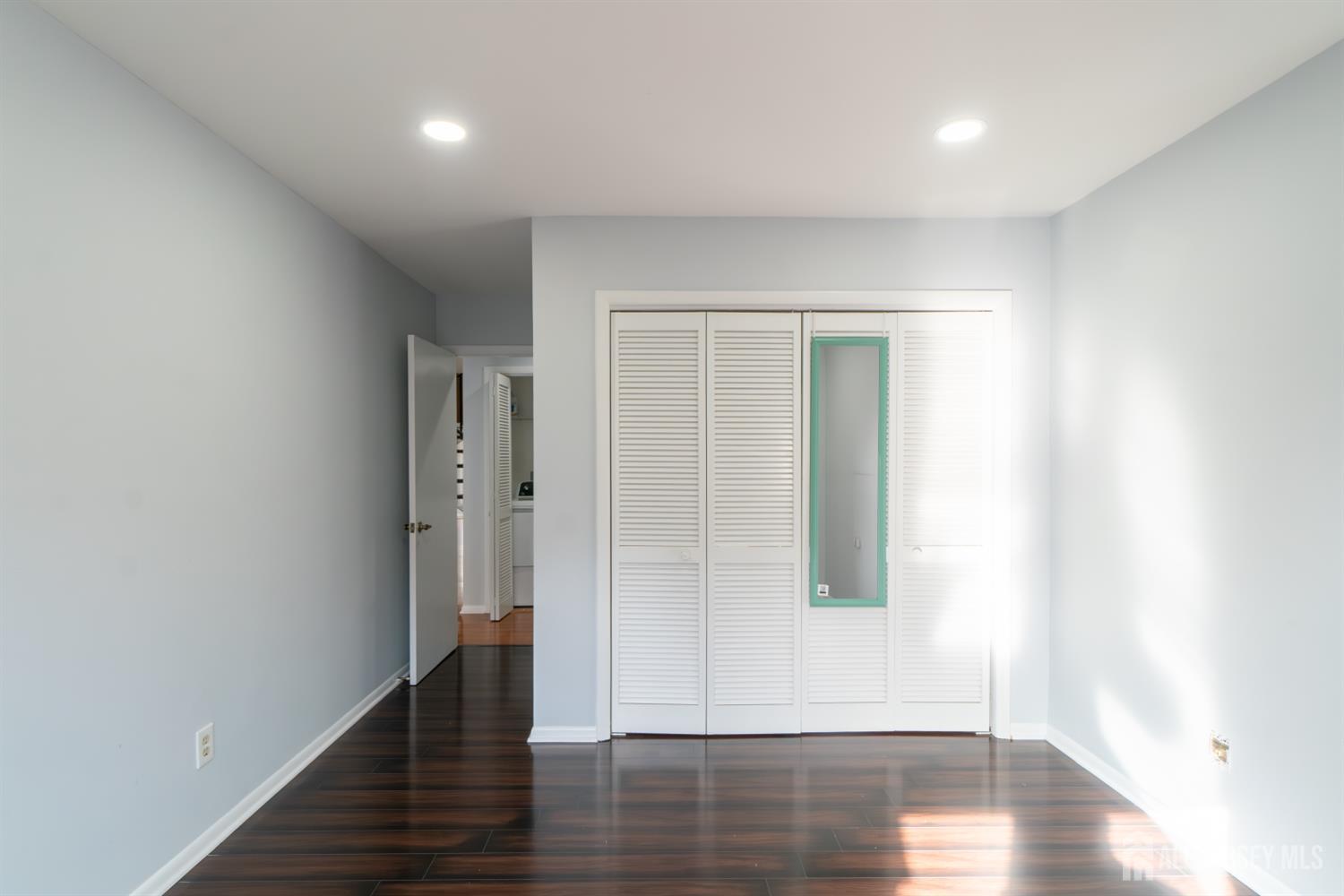 166 Hidden Hollow Court Edison, NJ 08820 - Photo 26 of 36 a view of hallway with wooden floor