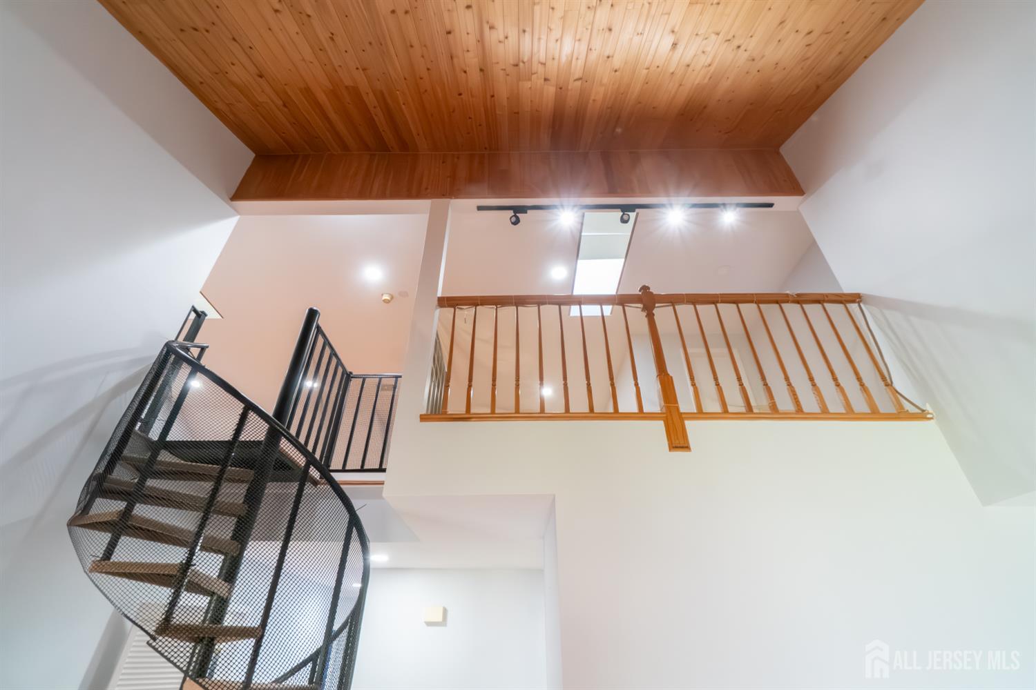 166 Hidden Hollow Court Edison, NJ 08820 - Photo 28 of 36 a view of staircase with white walls and a window