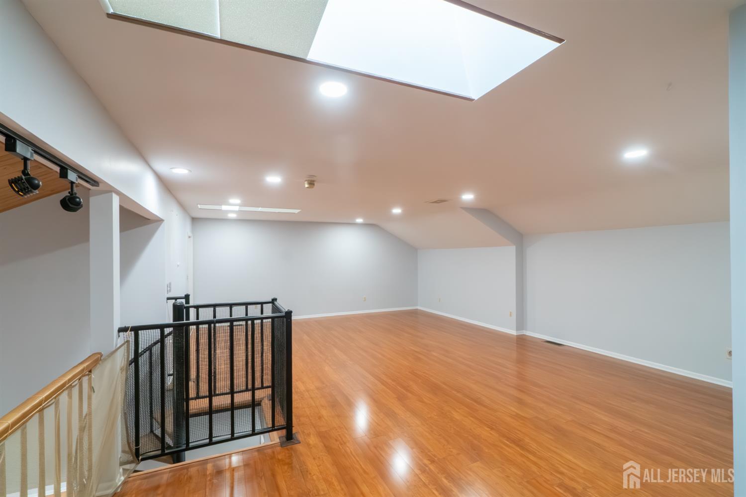 166 Hidden Hollow Court Edison, NJ 08820 - Photo 31 of 36 a view of gallery with wooden floor