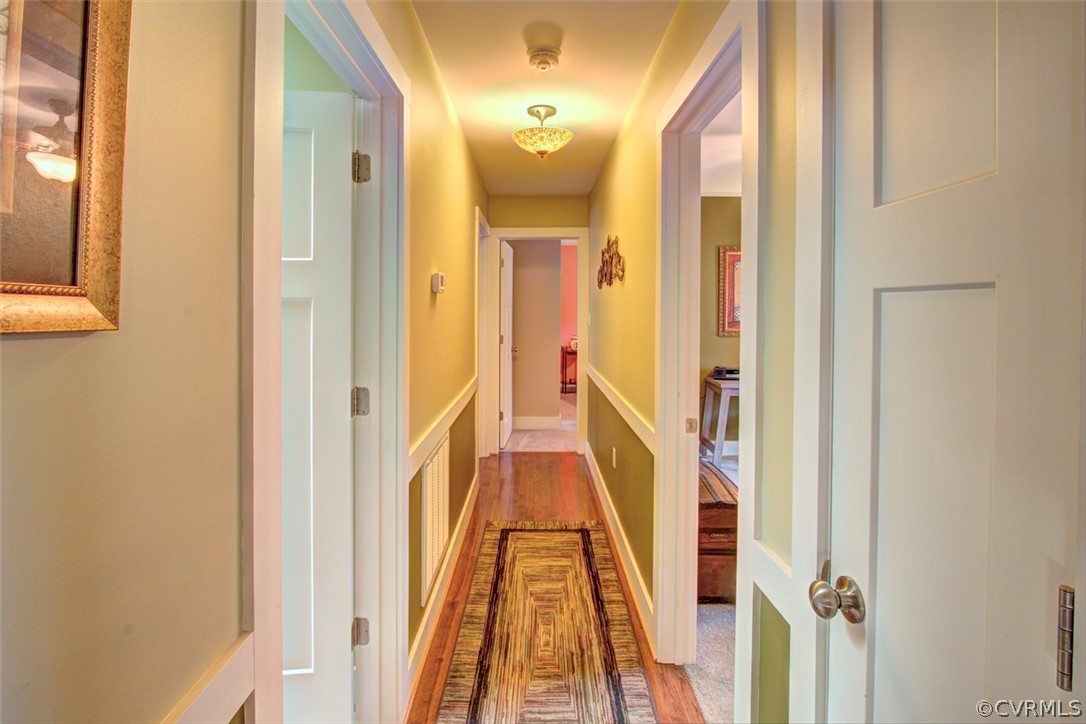 355 Manchester Road Bumpass, VA 23024 - Photo 13 of 43 Hallway to bedrooms with gleaming hardwood floors.