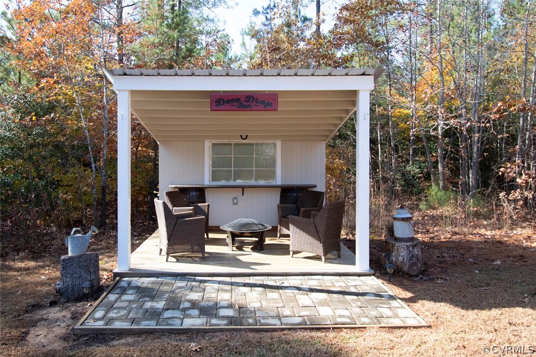 355 Manchester Road Bumpass, VA 23024 - Photo 26 of 43 This outdoor lounge is precious! Bar is made from