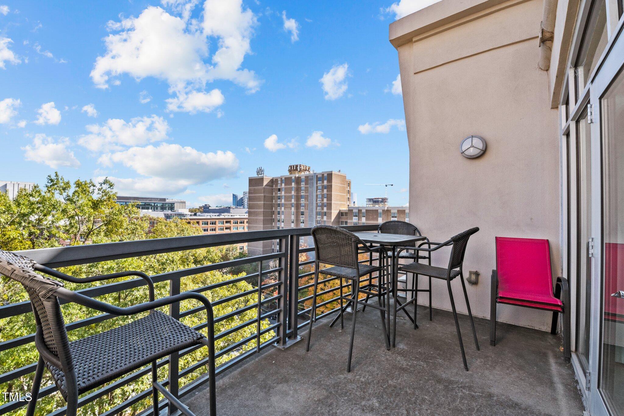 618 North Boylan Avenue, Unit 810 Raleigh, NC 27603 - Photo 14 of 57 a view of a chairs and table in the patio