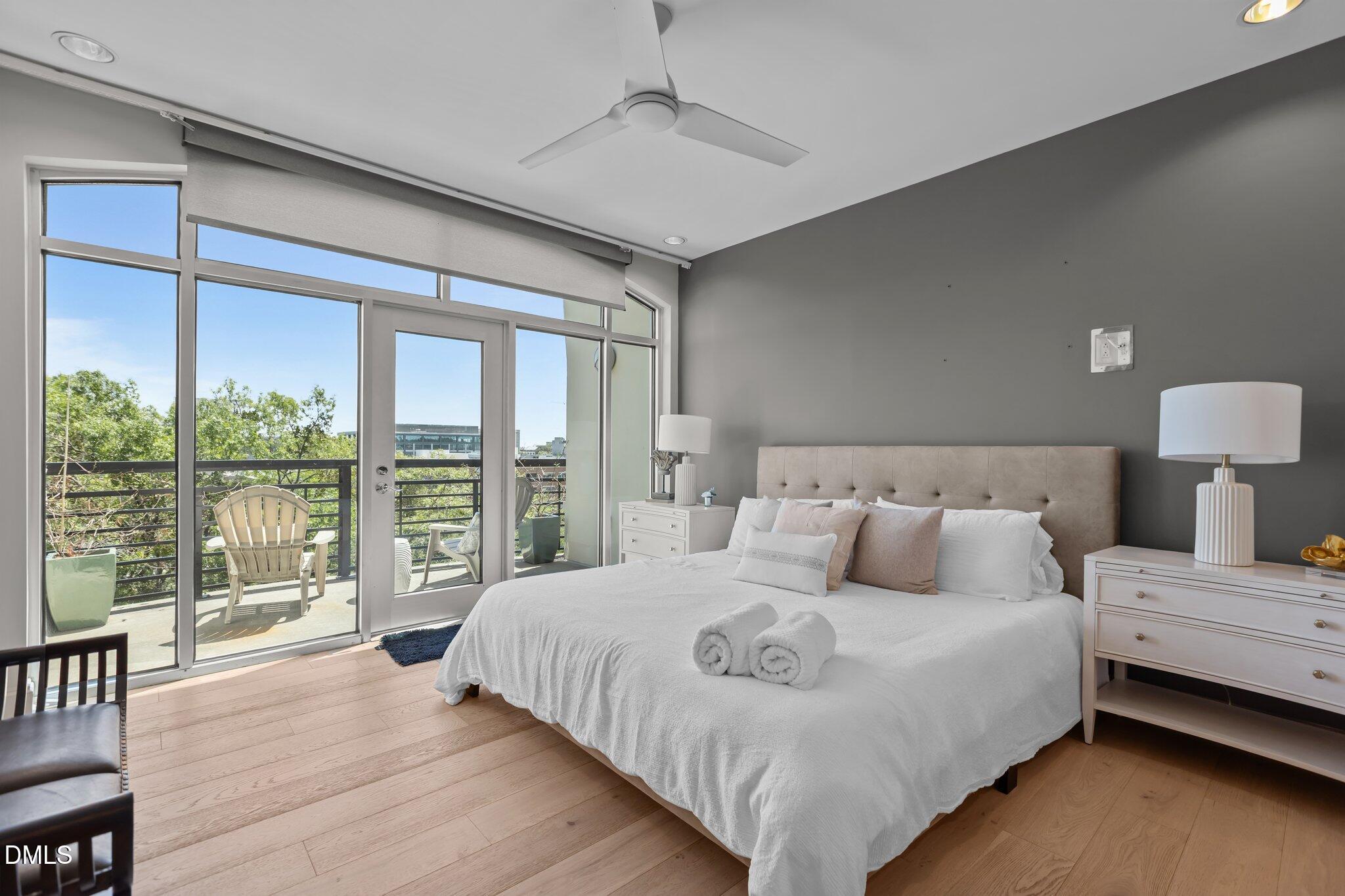 618 North Boylan Avenue, Unit 810 Raleigh, NC 27603 - Photo 22 of 57 a bedroom with a large bed and a large window