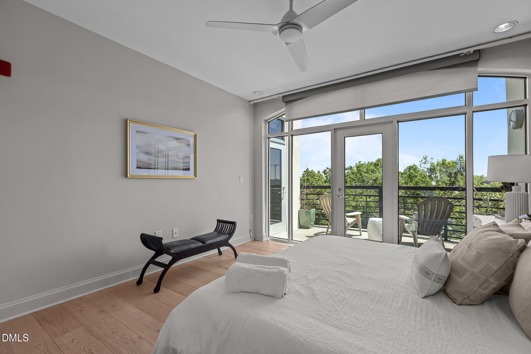 618 North Boylan Avenue, Unit 810 Raleigh, NC 27603 - Photo 26 of 57 a living room with furniture and a floor to ceiling window