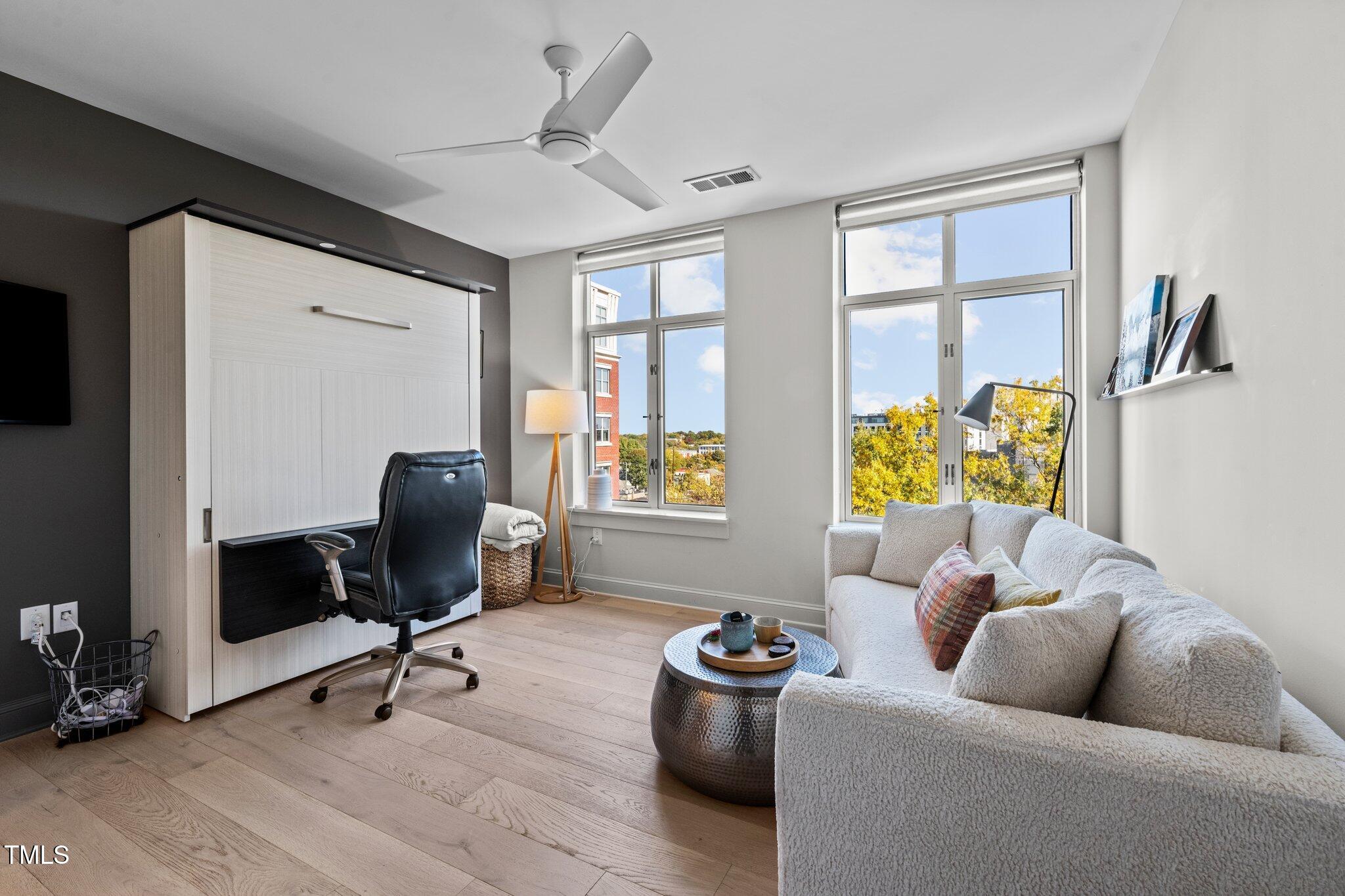 618 North Boylan Avenue, Unit 810 Raleigh, NC 27603 - Photo 32 of 57 a living room with furniture and a window
