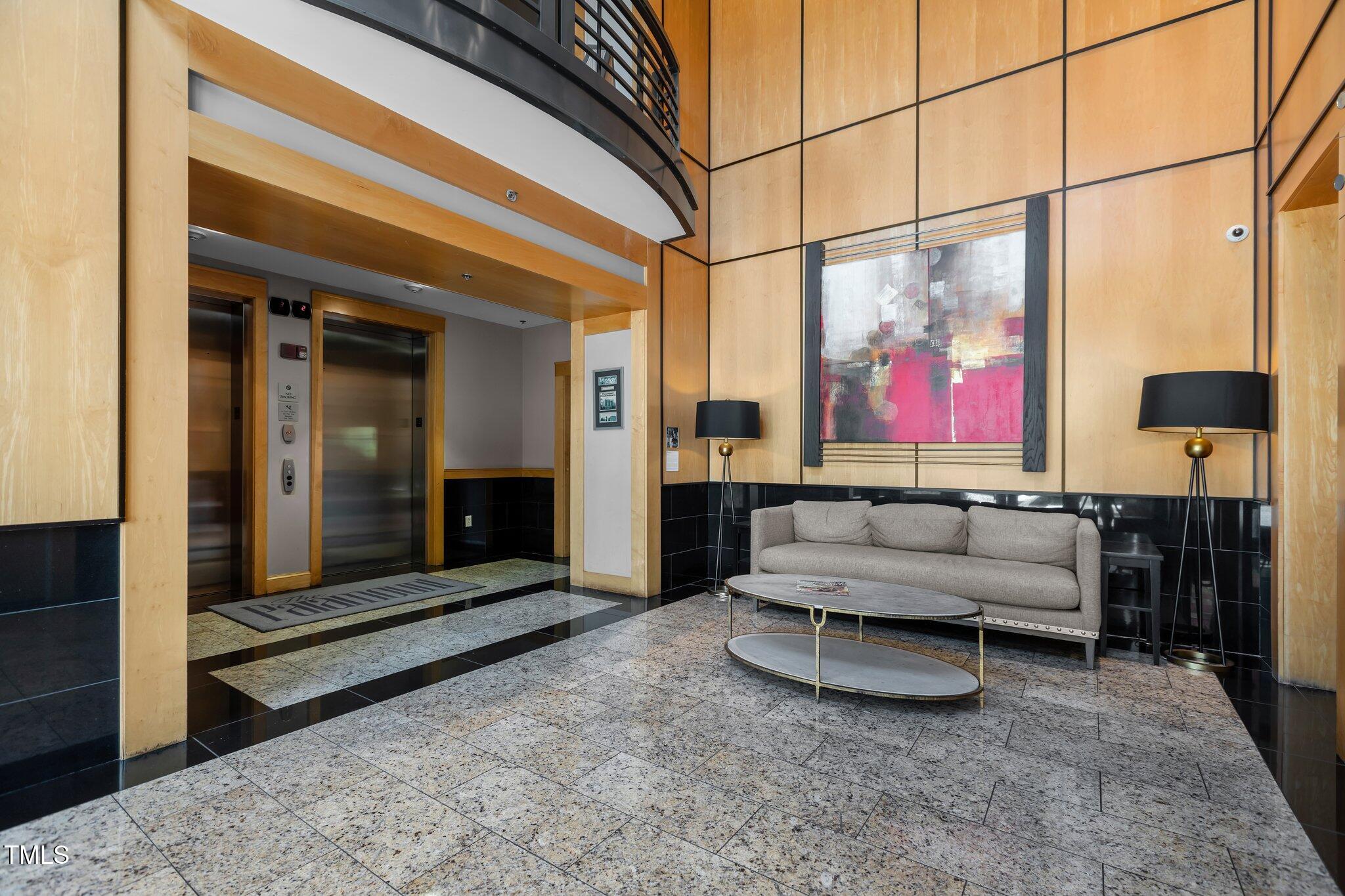 618 North Boylan Avenue, Unit 810 Raleigh, NC 27603 - Photo 40 of 57 a living room with furniture a flat screen tv and a floor