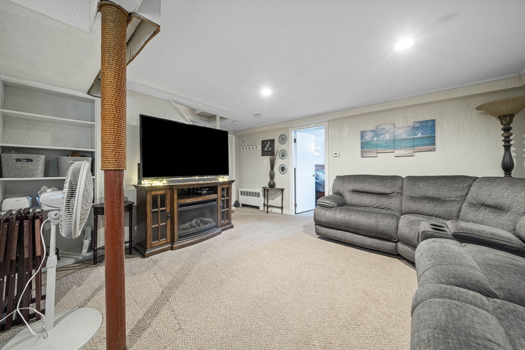 15 D Street Hull, MA 02045 - Photo 17 of 42 a living room with furniture and a flat screen tv