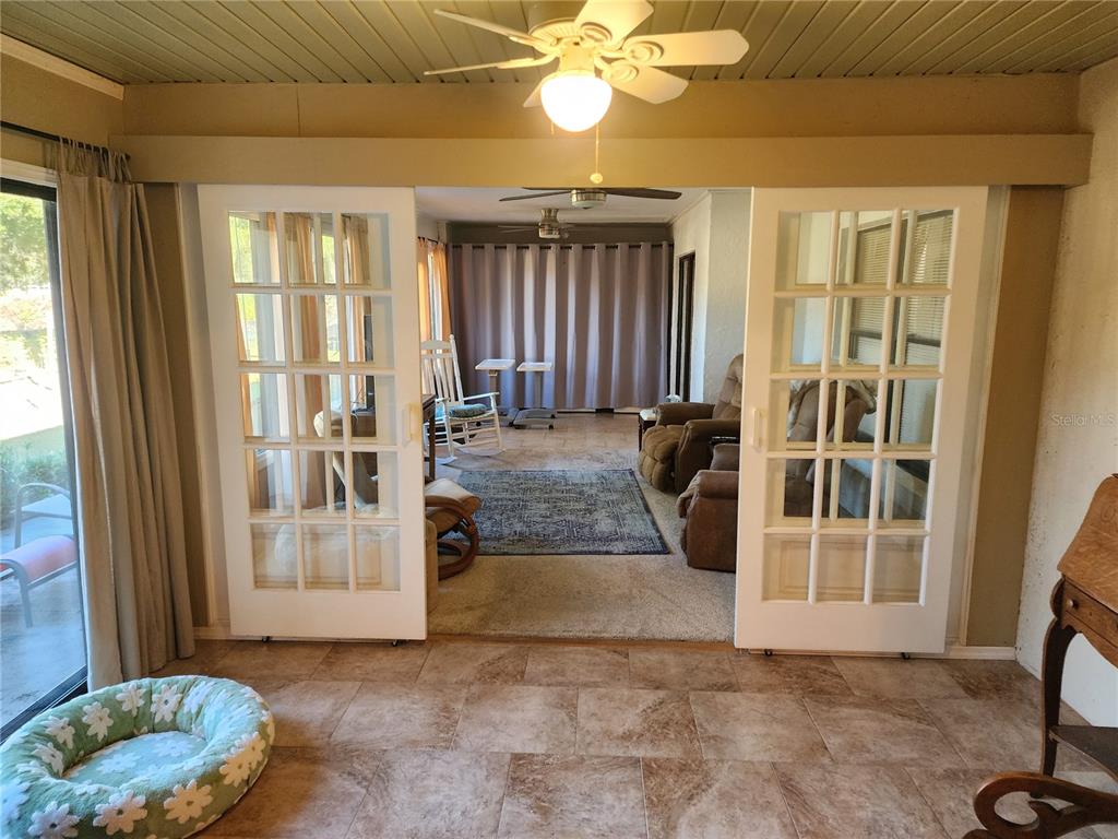 11759 Oswalt Road Clermont, FL 34711 - Photo 14 of 24 a view of a livingroom with a patio and wooden floor