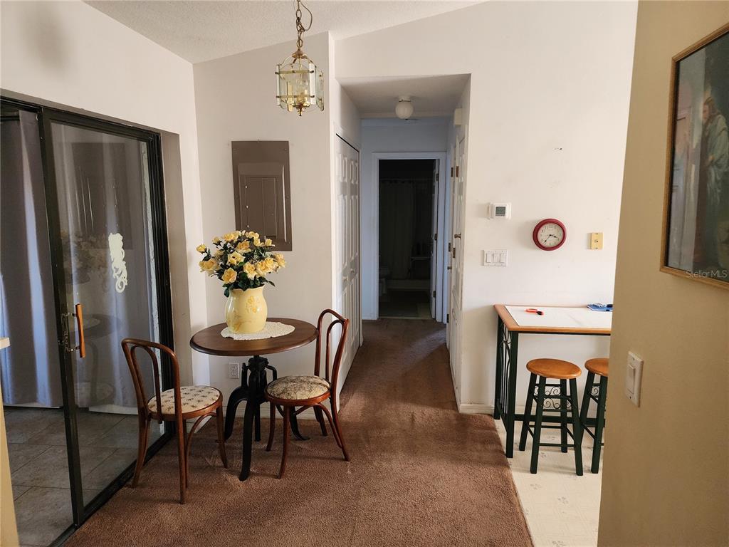 11759 Oswalt Road Clermont, FL 34711 - Photo 17 of 24 a dining room with furniture and window